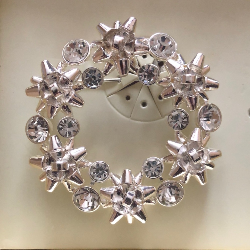 Silver Dana Buchman Brooch with diamond accent.